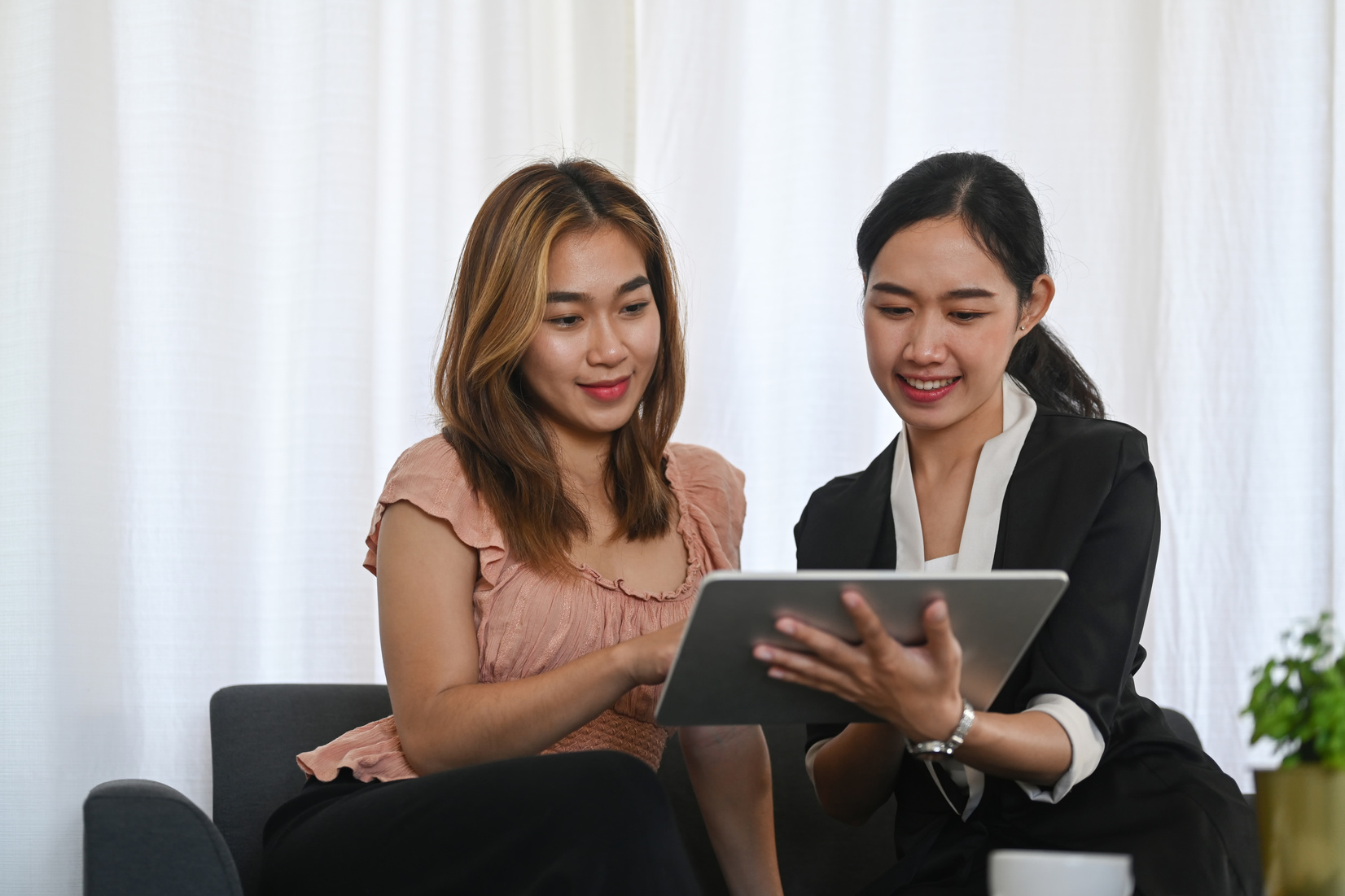 Friendly Asian Female Agent Offering Health Insurance for Young